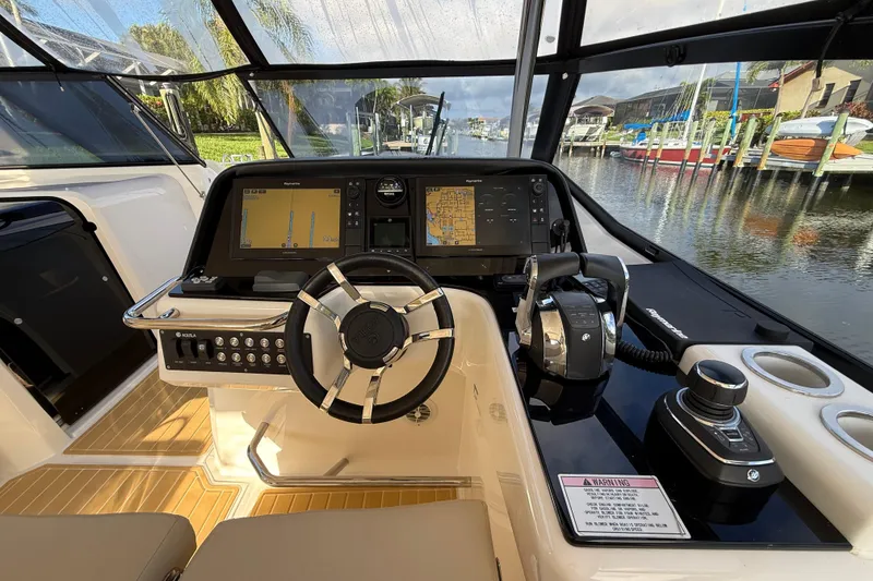 Slide: The Image of Cockpit of 2019 Aquila 36 Sport boat with modern navigation system and controls. - 29