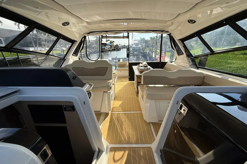 Slide: The Image of Interior view of 2019 Aquila 36 Sport yacht with luxurious seating and panoramic windows. - 31