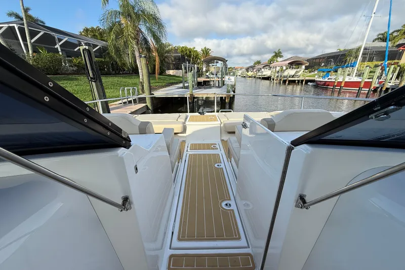 Slide: The Image of Aquila 36 Sport 2019 boat interior with dockside view and palm trees. - 39