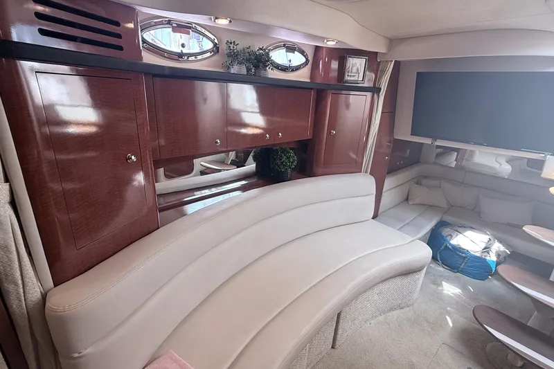 Slide: The Image of Luxurious interior of 2004 Sea Ray 340 Sundancer yacht with elegant seating and cabinetry. - 14