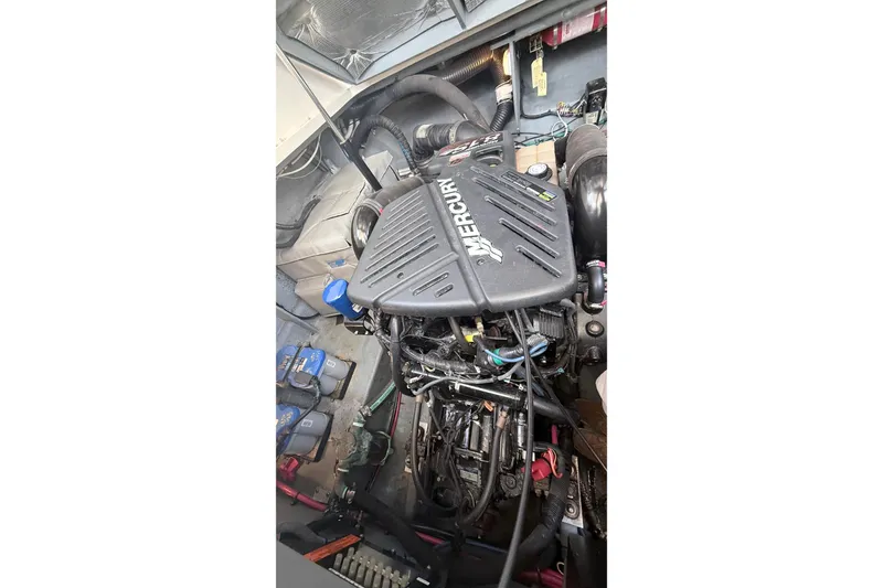 Slide: The Image of Engine compartment of a 2004 Sea Ray 340 Sundancer with Mercury engine. - 19