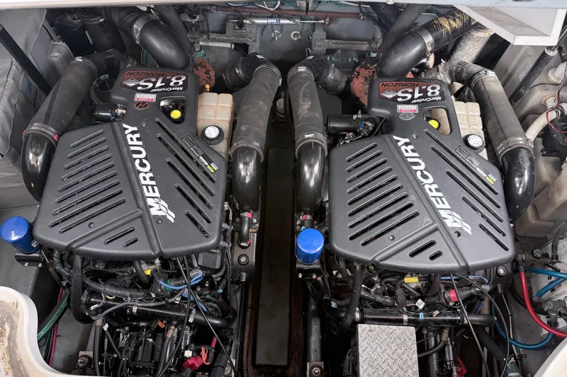 Slide: The Image of Twin Mercury engines in a 2004 Sea Ray 340 Sundancer boat engine compartment. - 21