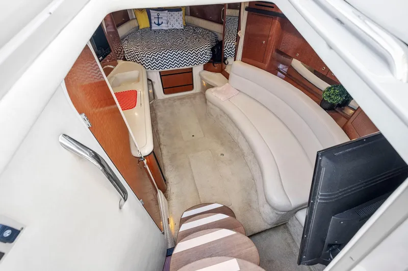 Slide: The Image of Luxurious interior of 2004 Sea Ray 340 Sundancer yacht with cozy seating and modern amenities. - 24