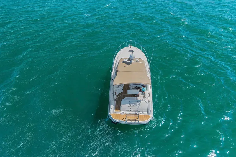 Slide: The Image of Aerial view of 2004 Sea Ray 340 Sundancer yacht on open water. - 38