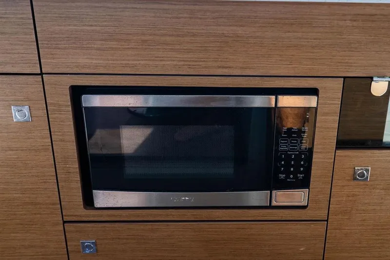 Slide: The Image of Built-in microwave in 2023 Jeanneau NC 1095 yacht kitchen. - 40