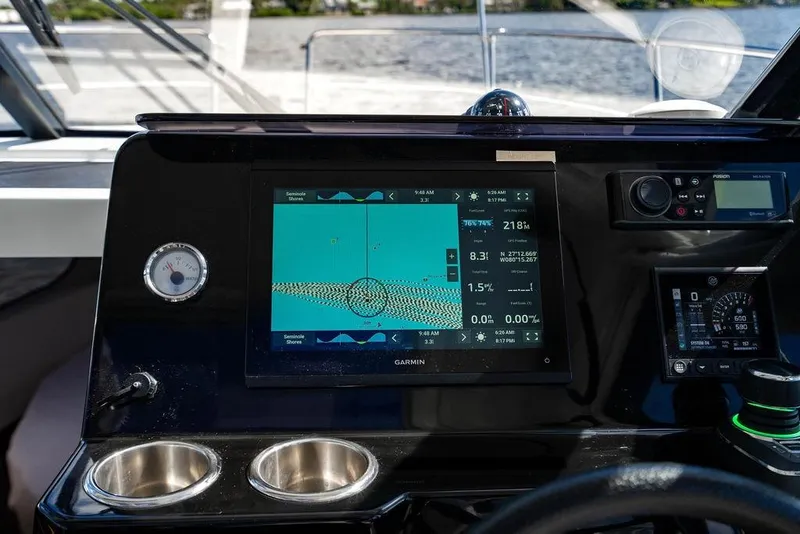 Slide: The Image of Dashboard of 2023 Jeanneau NC 1095 boat with navigation display and controls. - 49