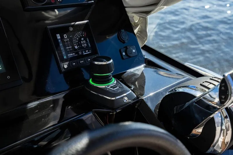 Slide: The Image of Control panel of 2023 Jeanneau NC 1095 boat with navigation instruments and joystick. - 50