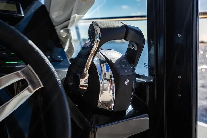 Slide: The Image of Throttle control of 2023 Jeanneau NC 1095 boat, close-up view. - 51