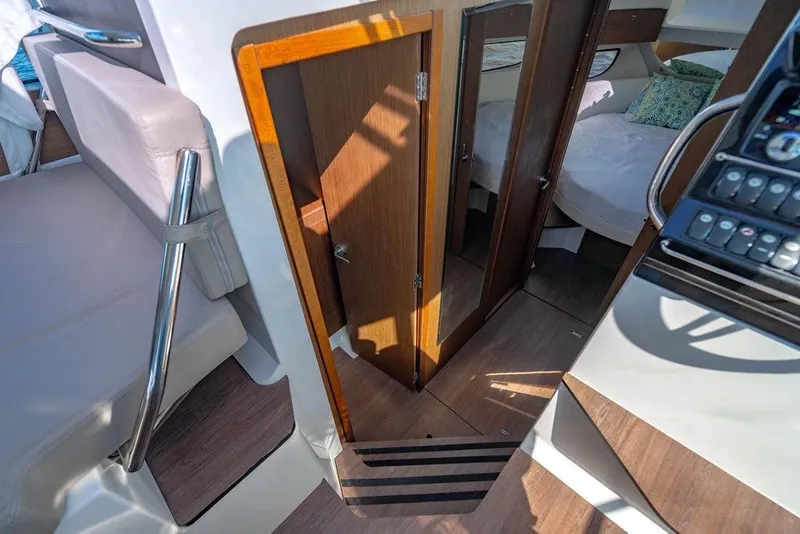 Slide: The Image of Interior view of 2023 Jeanneau NC 1095 boat, featuring cabin and helm area. - 53