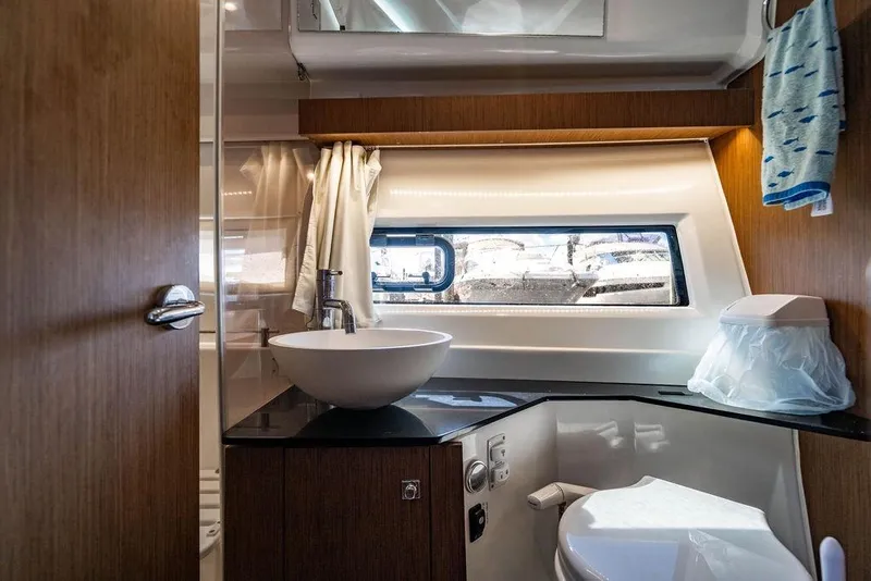 Slide: The Image of Modern bathroom interior of 2023 Jeanneau NC 1095 boat with sink and window view. - 61
