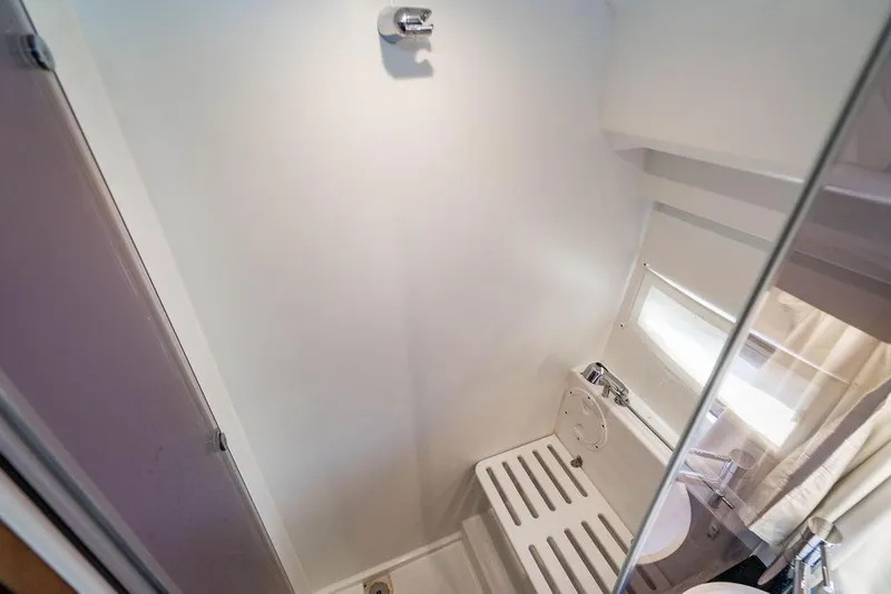 Slide: The Image of 2023 Jeanneau NC 1095 boat bathroom with shower and window. - 63