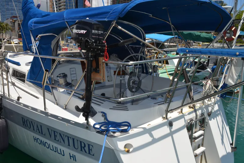 Slide: The Image of Sailboat "Royal Venture" docked in Honolulu, Norseman 400, 1987 model, with blue canopy. - 10