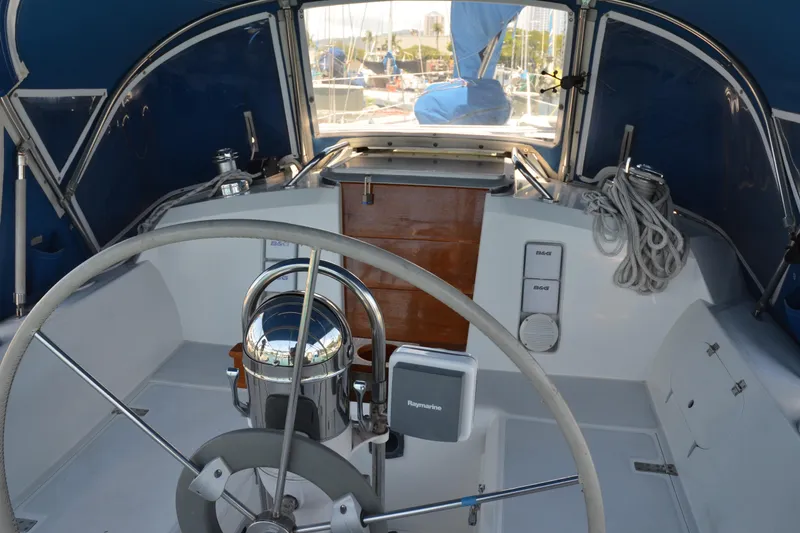 Slide: The Image of Cockpit of 1987 Norseman 400 sailboat with steering wheel and navigation equipment. - 15