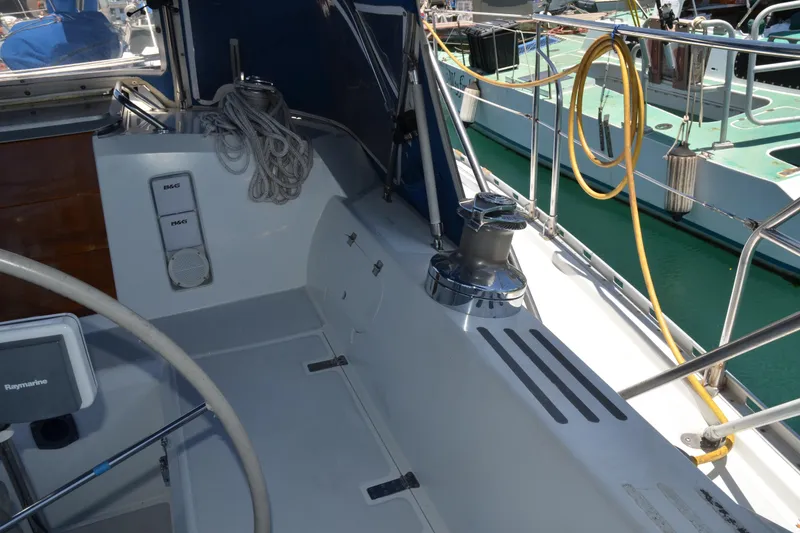 Slide: The Image of Cockpit of 1987 Norseman 400 sailboat with steering wheel and winch. - 16