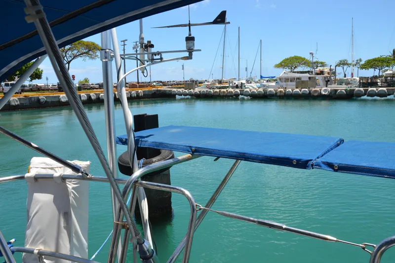 Slide: The Image of Sailboat docked in marina, Norseman 400, 1987 model, with clear blue water and sky. - 19