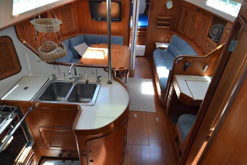 Slide: The Image of Interior of 1987 Norseman 400 yacht with wood finish and cozy seating area. - 21