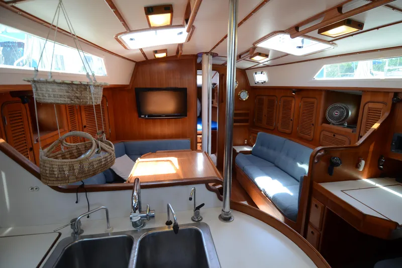 Slide: The Image of Interior of 1987 Norseman 400 yacht with wood paneling and modern amenities. - 24