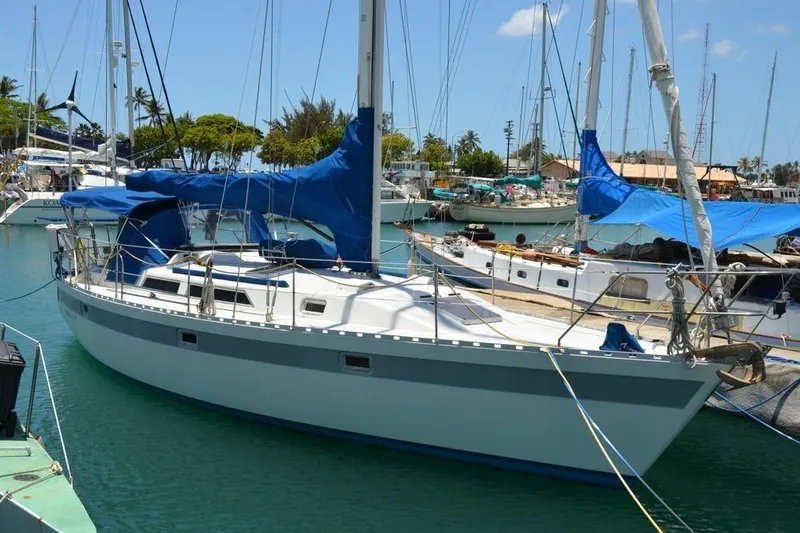 Slide: The Image of 1987 Norseman 400 sailboat docked in a marina. - 4