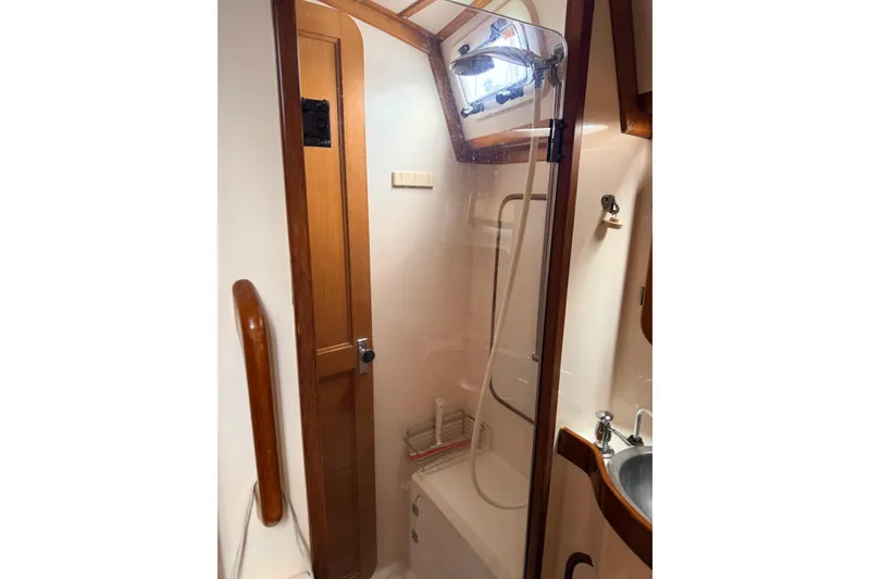 Slide: The Image of Compact bathroom in 1987 Norseman 400 yacht with shower and sink. - 54