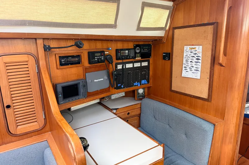 Slide: The Image of 1987 Norseman 400 yacht interior with navigation equipment and wooden cabinetry. - 67