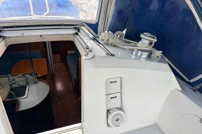 Slide: The Image of Interior view of 1987 Norseman 400 sailboat with kitchen and seating area. - 25