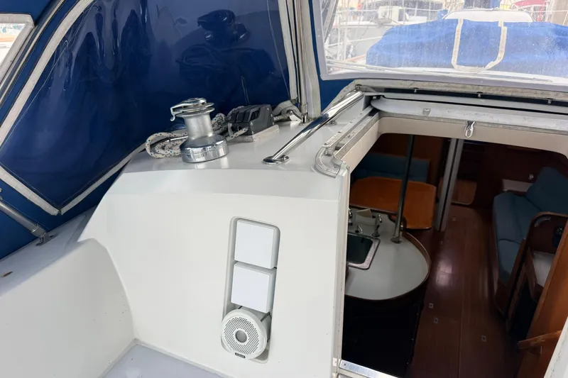 Slide: The Image of Interior view of 1987 Norseman 400 sailboat with blue canopy and cabin entrance. - 24