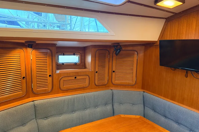 Slide: The Image of Interior of 1987 Norseman 400 yacht with wood paneling and seating area. - 44