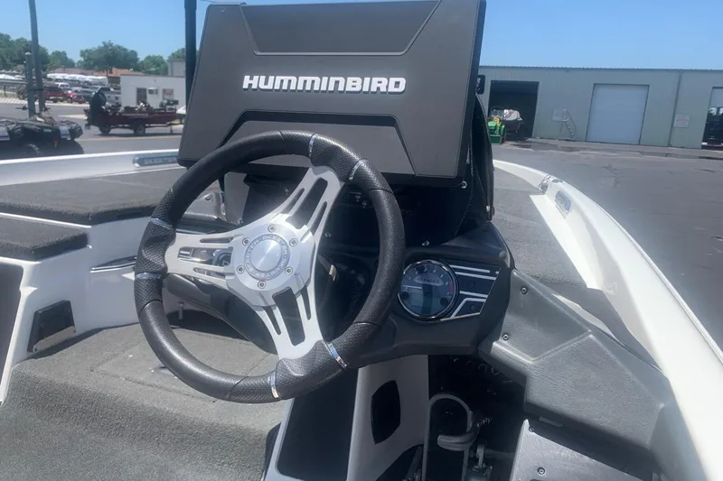 Slide: The Image of 2020 Skeeter FXR21 boat dashboard with Humminbird electronics and steering wheel. - 3