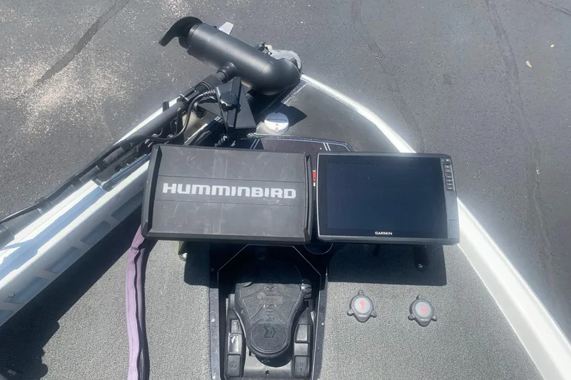 Slide: The Image of 2020 Skeeter FXR21 boat dashboard with Humminbird and Garmin displays. - 4