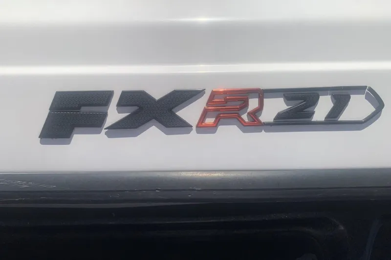 Slide: The Image of 2020 Skeeter FXR21 logo on a white surface, featuring bold black and red lettering. - 9