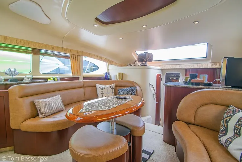 Slide: The Image of Luxurious interior of 2005 Sea Ray 390 Motor Yacht with elegant seating and decor. - 10