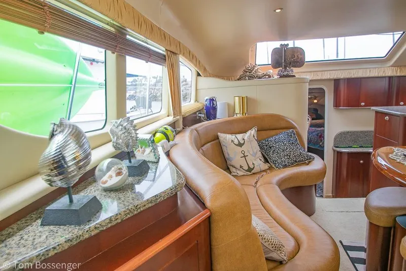 Slide: The Image of Luxurious interior of 2005 Sea Ray 390 Motor Yacht with elegant decor and comfortable seating. - 33