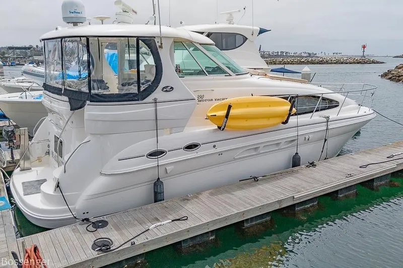 Slide: The Image of 2005 Sea Ray 390 Motor Yacht docked with a yellow kayak attached. - 41
