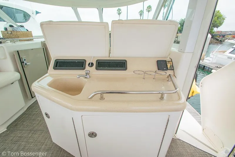 Slide: The Image of 2005 Sea Ray 390 Motor Yacht interior with sink and countertop, docked by the water. - 46