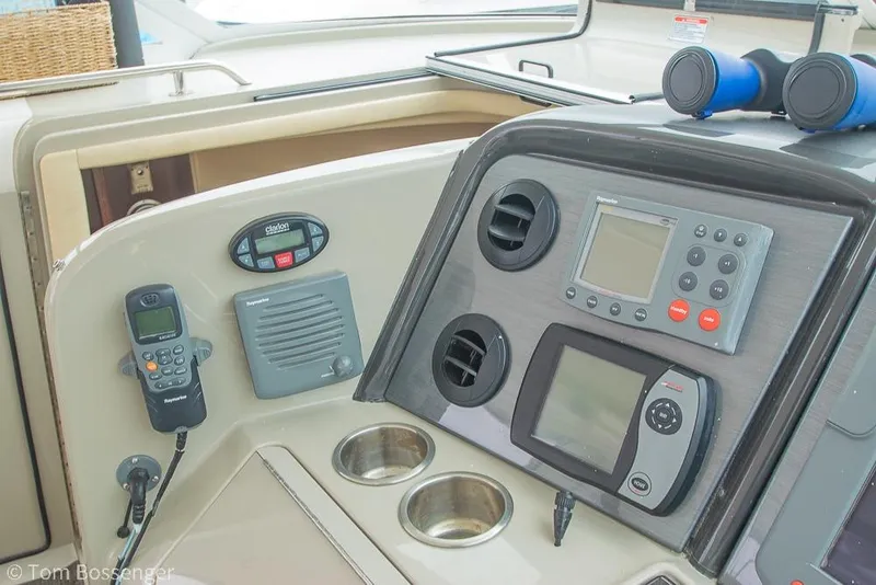 Slide: The Image of Control panel of a 2005 Sea Ray 390 Motor Yacht with navigation equipment. - 56