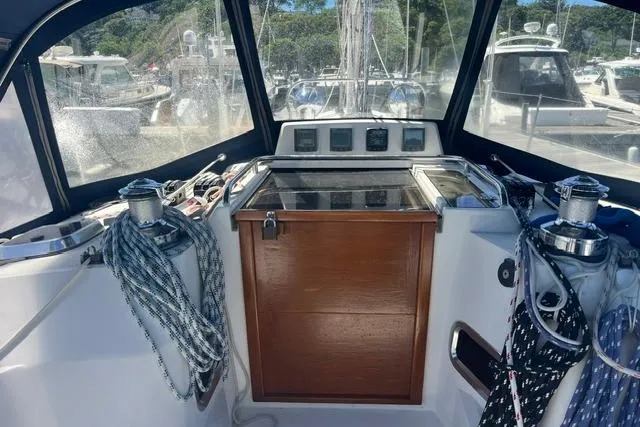 Slide: The Image of Cockpit of 2002 Sabre 452 sailboat with ropes and wooden hatch. - 12