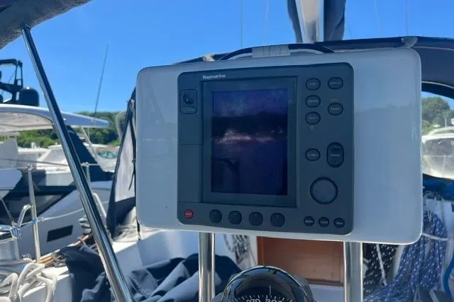 Slide: The Image of Boat navigation system on a 2002 Sabre 452 yacht, docked in a marina. - 13