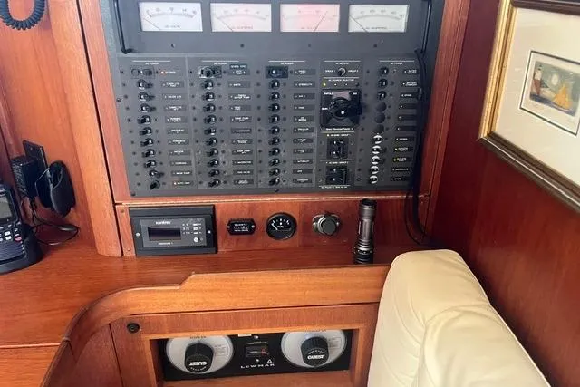 Slide: The Image of Control panel of a 2002 Sabre 452 yacht with gauges and switches. - 24