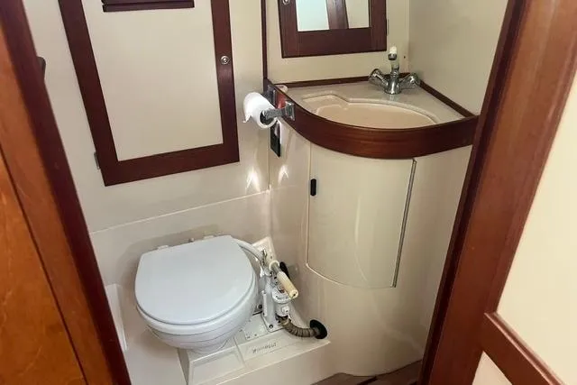 Slide: The Image of Compact marine bathroom in 2002 Sabre 452 yacht with toilet and sink. - 27