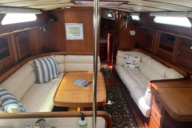 Slide: The Image of Luxurious 2002 Sabre 452 yacht interior with elegant wood finish and comfortable seating. - 3