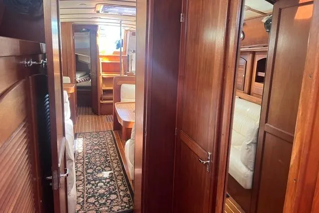 Slide: The Image of Interior of 2002 Sabre 452 yacht with wooden finish and cozy seating area. - 35