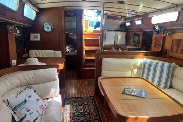 Slide: The Image of Luxurious interior of 2002 Sabre 452 yacht with elegant wood finish and comfortable seating. - 39