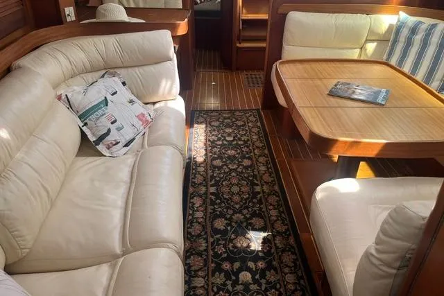 Slide: The Image of Luxurious interior of 2002 Sabre 452 yacht with leather seating and wooden table. - 40