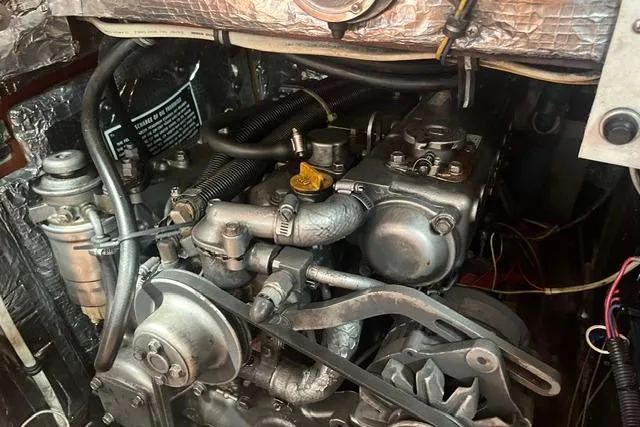 Slide: The Image of Engine compartment of a 2002 Sabre 452, showcasing mechanical components and wiring. - 45