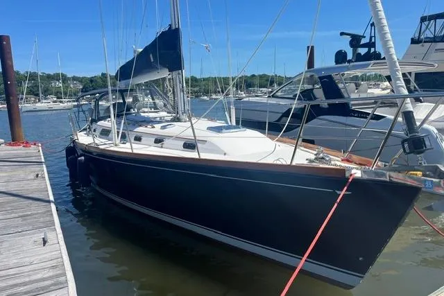 Slide: The Image of Sailboat docked at marina, 2002 Sabre 452 model, clear blue sky. - 54