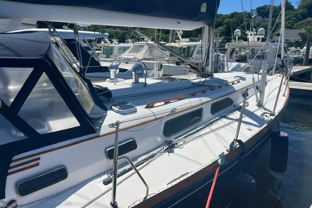 Slide: The Image of 2002 Sabre 452 sailboat docked at marina, featuring sleek design and modern amenities. - 9