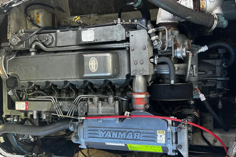 Slide: The Image of Engine of a 2000 Albin 28 Tournament Express boat, featuring a Yanmar 24-valve diesel engine. - 11