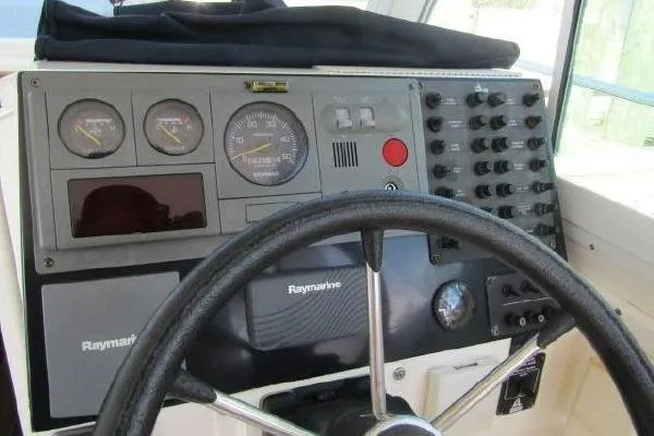Slide: The Image of Dashboard of a 2000 Albin 28 Tournament Express with Raymarine navigation equipment. - 18