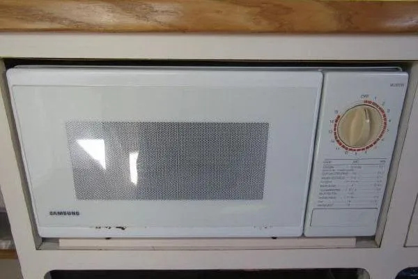 Slide: The Image of Built-in Samsung microwave in Albin 28 Tournament Express, 2000 model boat kitchen. - 33