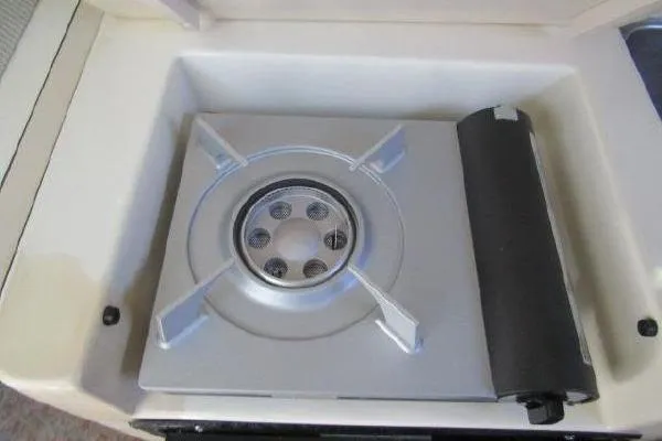 Slide: The Image of Built-in stove on 2000 Albin 28 Tournament Express boat, featuring a compact design. - 34